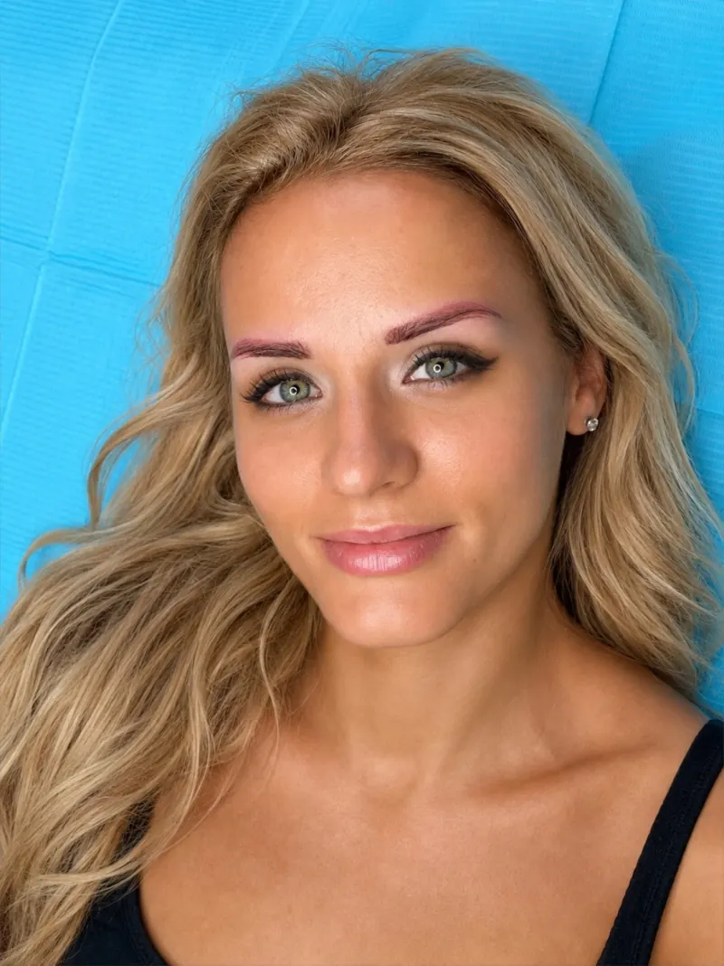 Old permanent makeup brows that have faded to a cool pink-grey tone, before color correction at Beauty Point